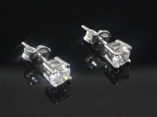 A pair of 18ct white gold and solitaire diamond ear studs,